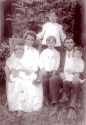 Jerome Lincoln Breighner (John Britner) standing between his parents with siblings Vernon, Seth and Paul